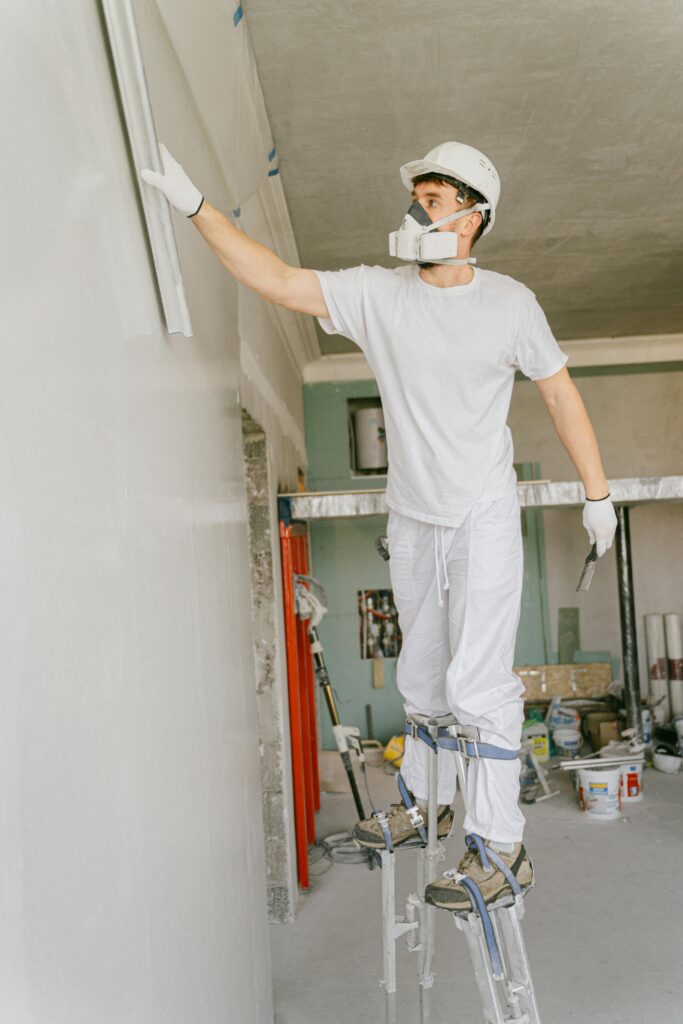Modern renovation craftsman plastering walls